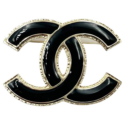 chanel brooch leather gold|Chanel lapel brooch.